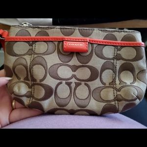 Orange and Beige Coach large wristlet